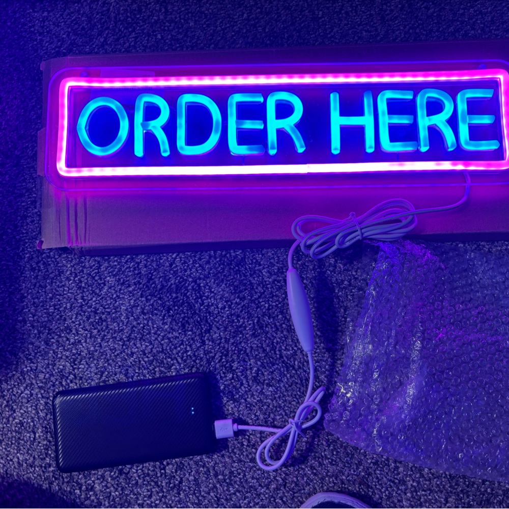 Vibrant Blue and Purple Neon Sign
